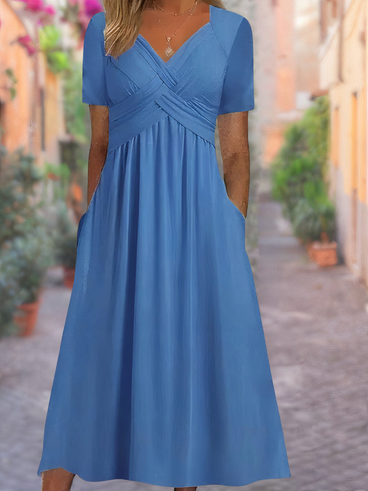 Mireya | Vestido cruzado con cintura ajustada y bolsillos laterales para mujer